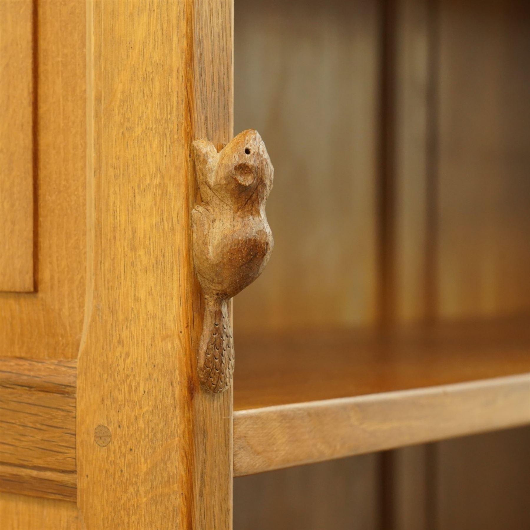 Beaverman - Yorkshire oak open bookcase, with adjustable shelves, panelled sides and lower cupboard doors, with carved beaver signature, by Colin Almack of Sutton near Thirsk
