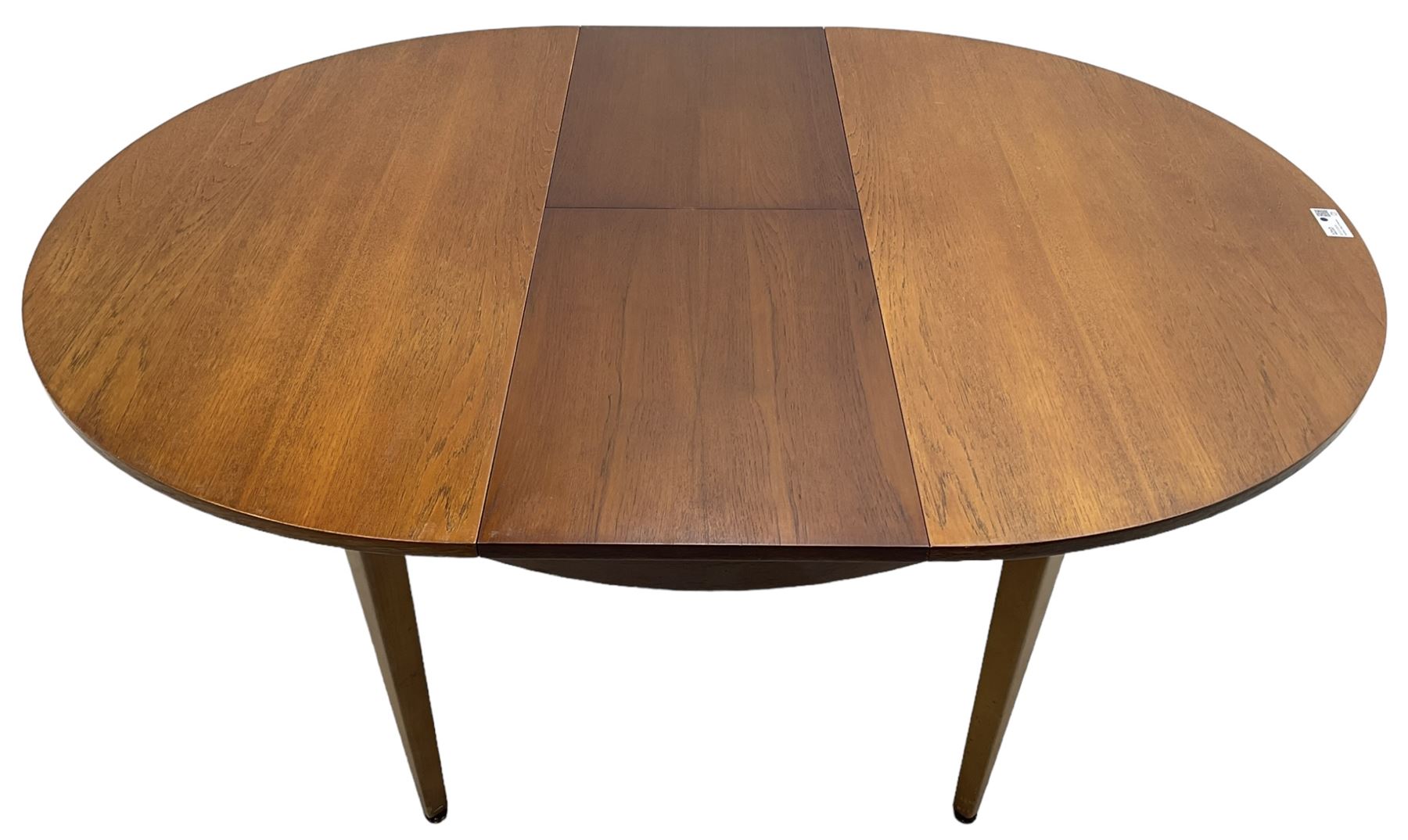 G-Plan - mid-20th century teak extending circular dining table, with concealed additional leaf (W114cm, H72cm); and a set of four mid-20th century teak dining chairs, seat upholstered in beige fabric