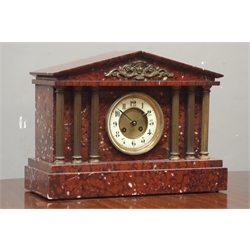  Late 19th century French rouge marble mantle clock, architectural cased with gilt metal columns, twin train movement striking the hours and half on coil, W41cm  