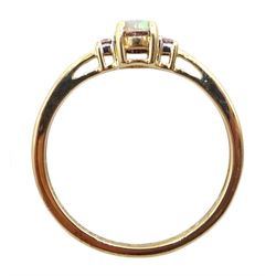 9ct gold three stone oval opal and diamond ring, hallmarked
