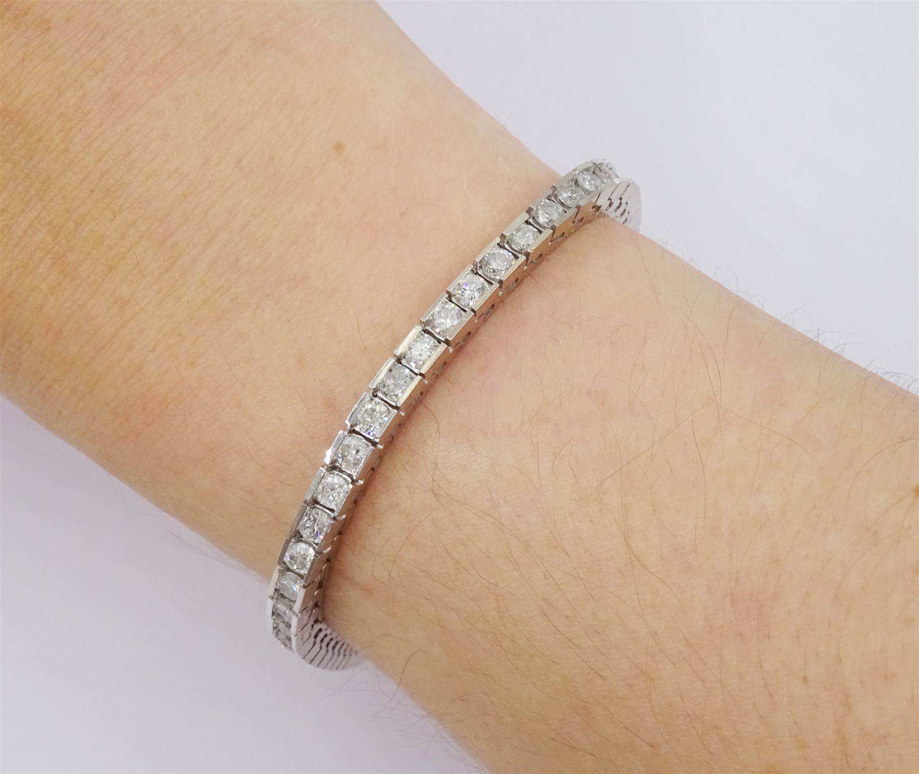 White gold round brilliant cut diamond line bracelet, stamped 14K, total diamond weight approx 4.85 carat