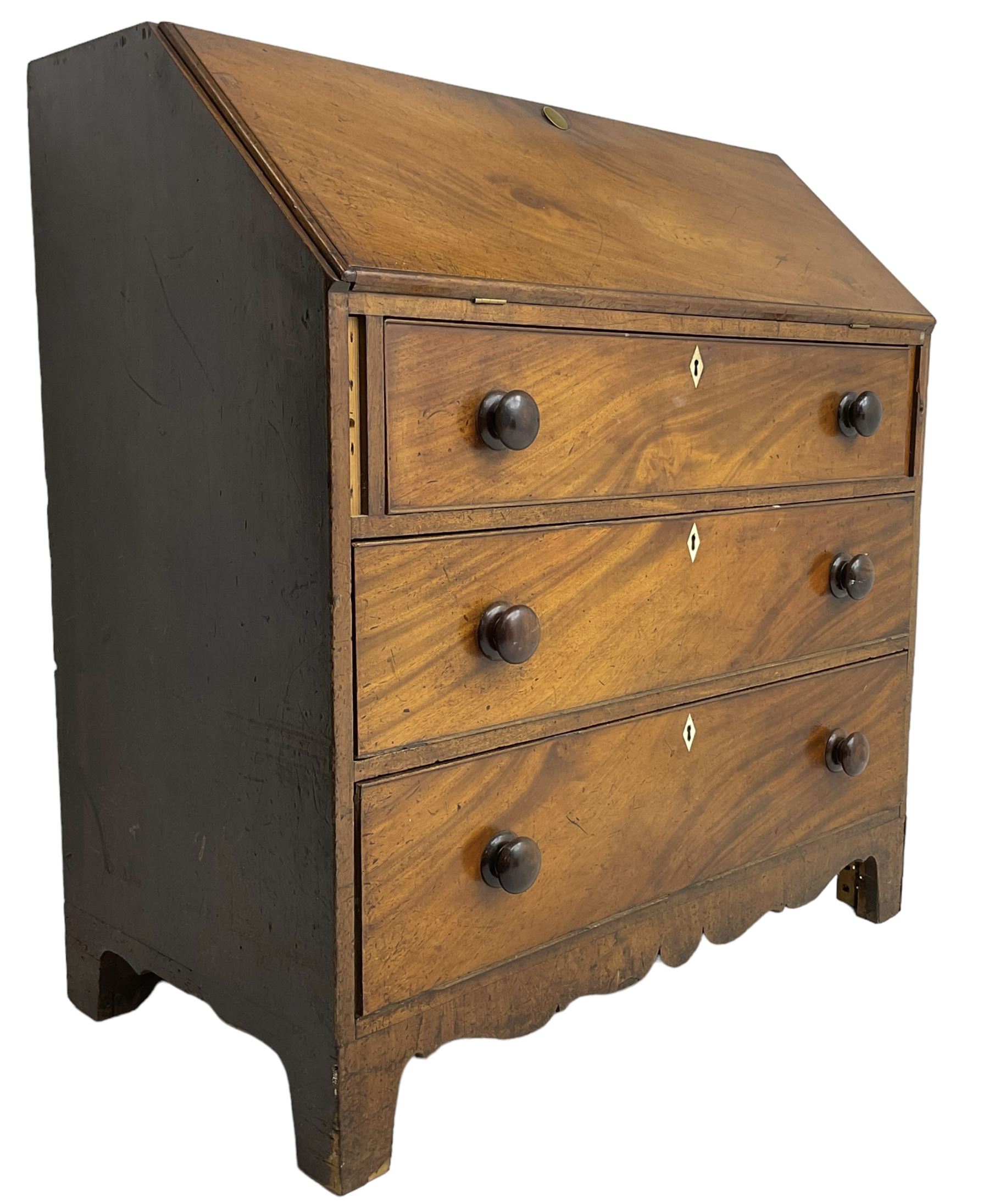 George III mahogany bureau, the fall front enclosing interior fitted with pigeon holes, drawers and cupboard, three graduating drawers below, with ivory escutcheons, shaped apron on bracket feet 

This item has been registered for sale under Section 10 of the APHA Ivory Act
