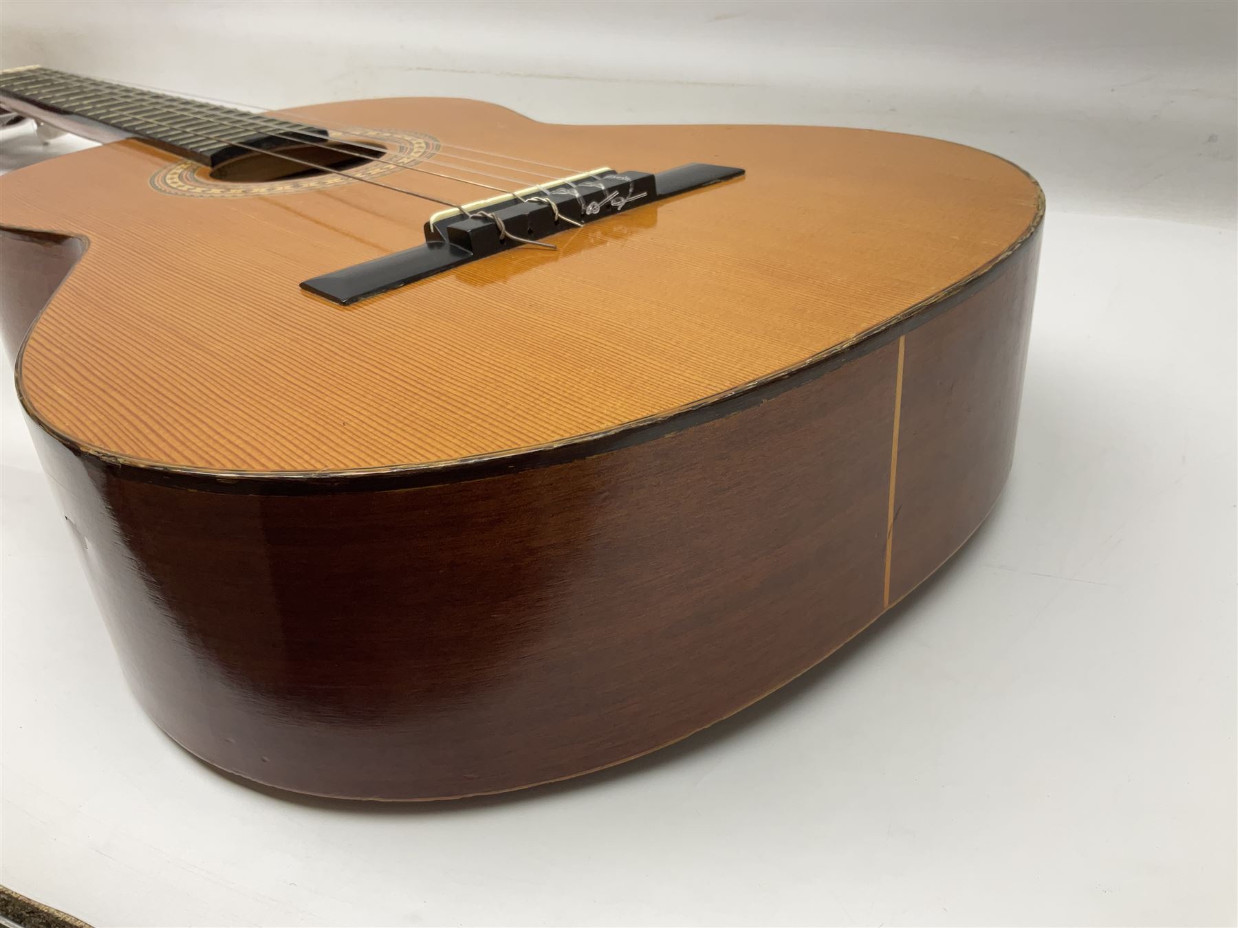 Spanish BM acoustic guitar with mahogany back and sides and spruce top L101cm; in cello carrying case; Roland foot pedal and two Yamaha foot pedals; tin D# organ pipe; folding music stand etc