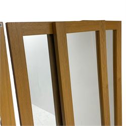 Four oak framed rectangular mirrors