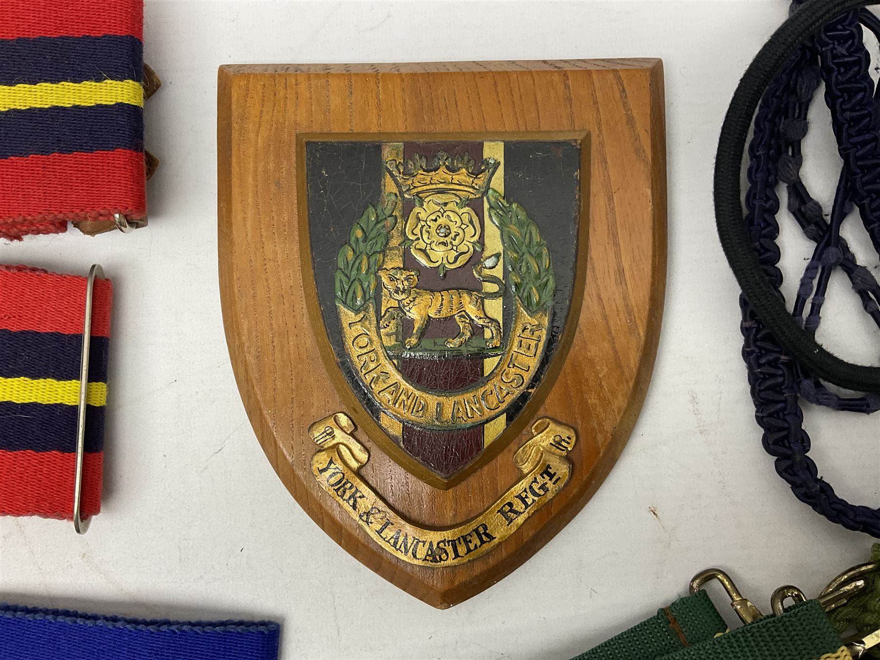 Miscellaneous militaria including two Royal Artillery and one Royal Horse Artillery stable belts; Northamptonshire Regiment trench art brass shell case lighter; unused Matchless Fire-Set; pocket knives and multi-tool; lanyards; oak shield with York & Lancaster crest etc