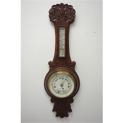  Early 20th century carved oak barometer (H75cm), and an Edwardian mahogany cased barometer   