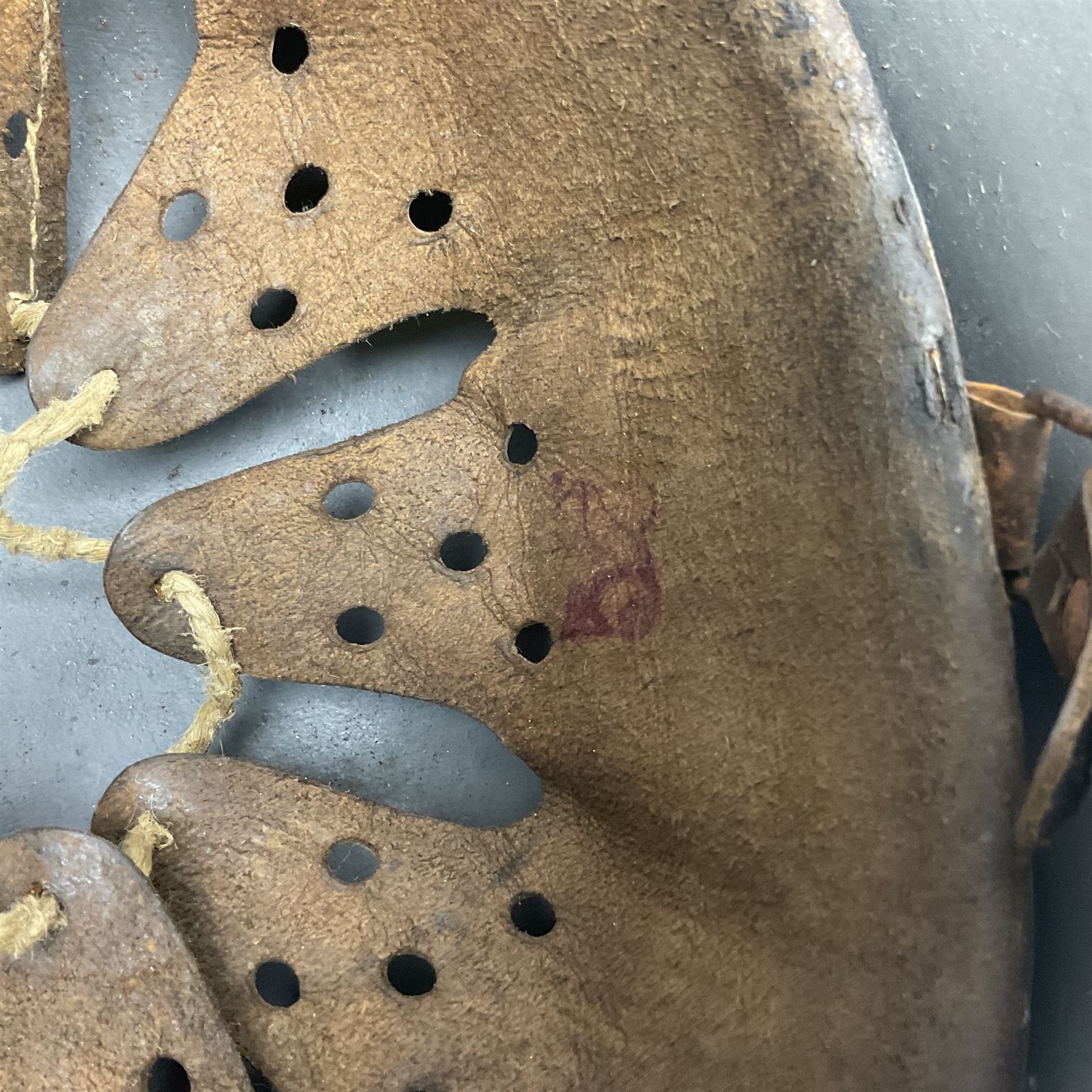 WW2 German Infantry M40 steel helmet with tropical finish and traces of single decal; with chin strap and leather liner marked 57 twice in red; back apron stamped 11 38