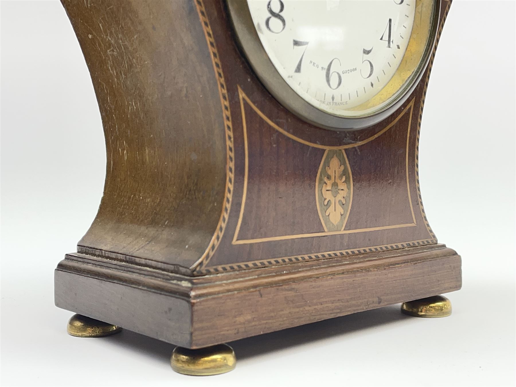 Edwardian inlaid mahogany mantel clock, pointed onion top and circular white enamel Roman dial signed 'Elkington', on brass feet 