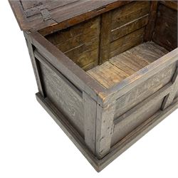 18th century oak coffer, double panelled hinged top with moulded rails, over panelled sides, on skirted base