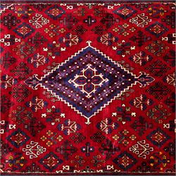 Central Persian Joshagan hand-knotted rug, madder-red field with central stepped lozenge medallion enclosed by angular spandrels, field decorated with repeating stylized geometric floral motifs and small diamond devices enclosed by a dark border of geometric ornament between multiple guard stripes, with cotton fringe ends  