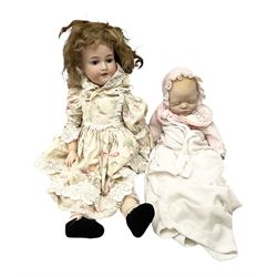 Armand & Marseille bisque head and composition bodied doll, with sleeping eyes and open mouth, the back of the head impressed 390, together with a further later doll 