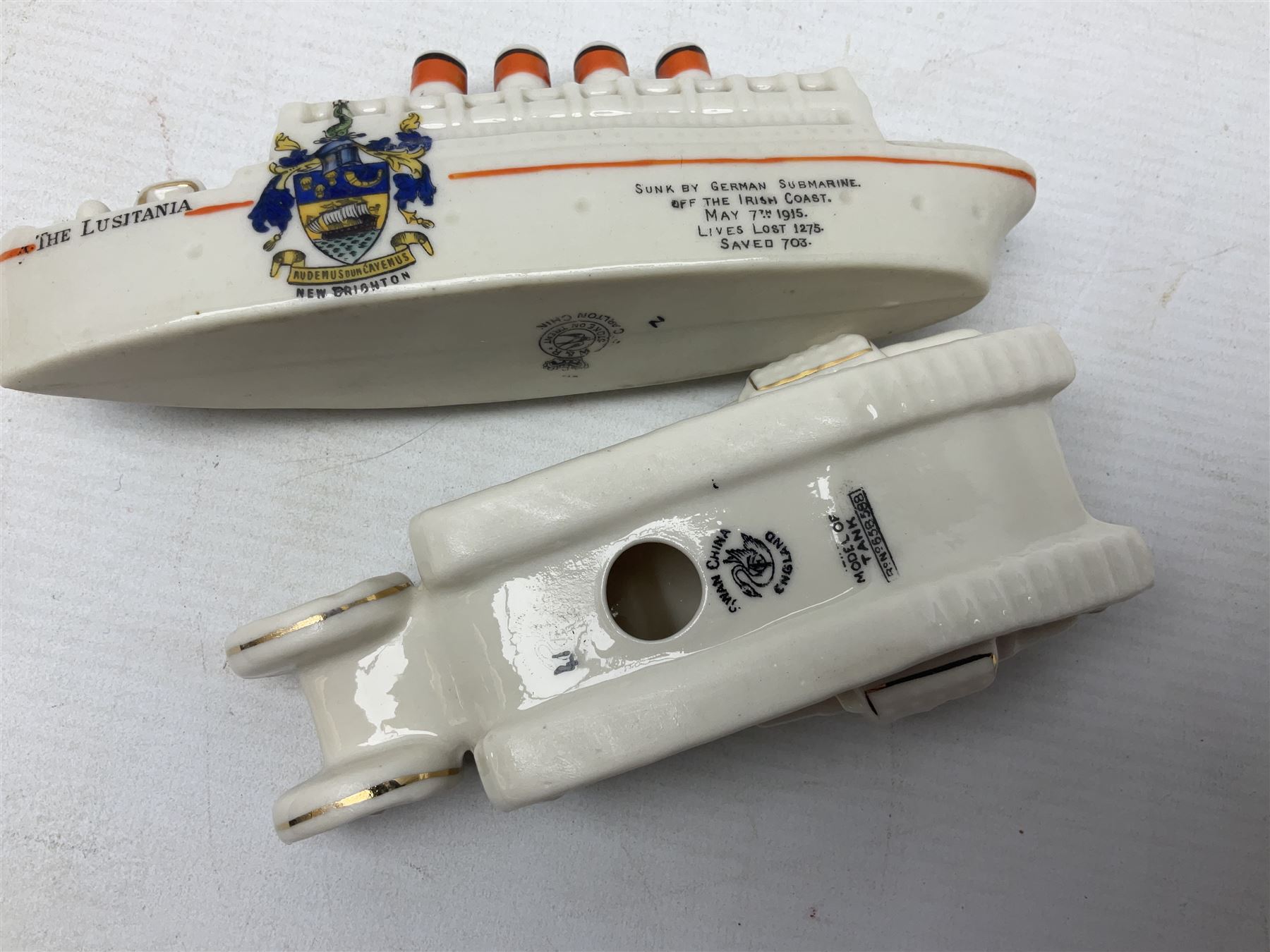 Twelve crested china models of WW1 tanks by Grafton, Arcadian and Carlton china etc with crests from Caistor Lincs, Saffron Walden, Paignton, Evesham etc  , together with a crested china model of the R.M.S Lusitania with New Brighton crest and a two-handled vase for 'The Forts Boxhill' (14)