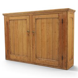 Victorian waxed pine low cupboard, fitted with two panelled doors and panelled sides, two interior shelves