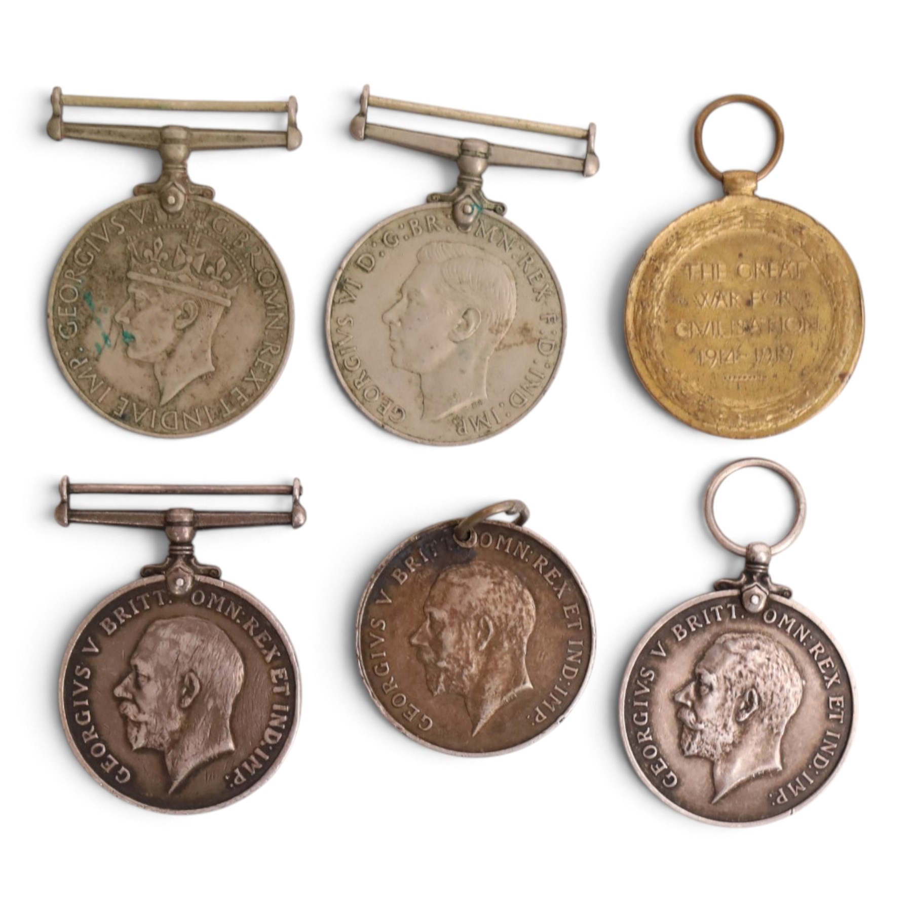 WWI British medal set, comprising George V Royal Fleet Reserve Long Service medal, War medal and Victory medal, awarded to J. 47087 T. Sharpe A.B.R.N, together with another WWI War medal, two WWII Defence medals and two sweetheart badges  