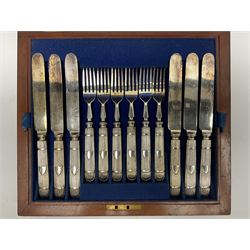 Victorian silver plated dessert set by Elkington & Co for twelve place settings, each reeded handle with vacant cartouche, each with Elkington & Co mark, date letter for 1861, and registration lozenge, contained within a mahogany case with vacant brass cartouche to the hinged cover, opening to reveal a Royal blue baize lined interior with removable tray, case H6cm W29.5cm D26.5cm