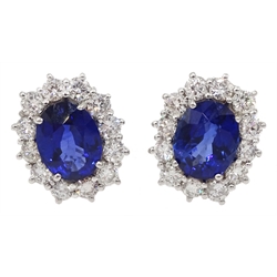 Pair of 18ct white gold sapphire and diamond cluster stud earrings, hallmarked, sapphire total weight approx 4.30 carat, diamond total weight approx 0.80 carat