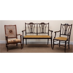  Late Victorian mahogany framed two seat sofa, scrolled cresting rail, upholstered seat, tapering supports (W113cm) a matching armchair, and a cane back chair (3)  