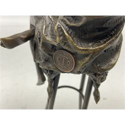 Art Deco style bronze modelled as a female figure seated upon a chair holding an apple, after 'Pierre Collinet', H28cm