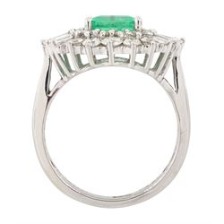 18ct white gold Colombian emerald and diamond cluster ring by Iliana, single octagonal cut emerald of 1.65 carat, surrounded by two rows of round brilliant cut and tapered baguette cut diamonds, hallmarked