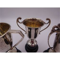 Three small silver twin handled trophy cups, all with personal engraving to body and upon ebonised bases, all hallmarked, tallest H12cm