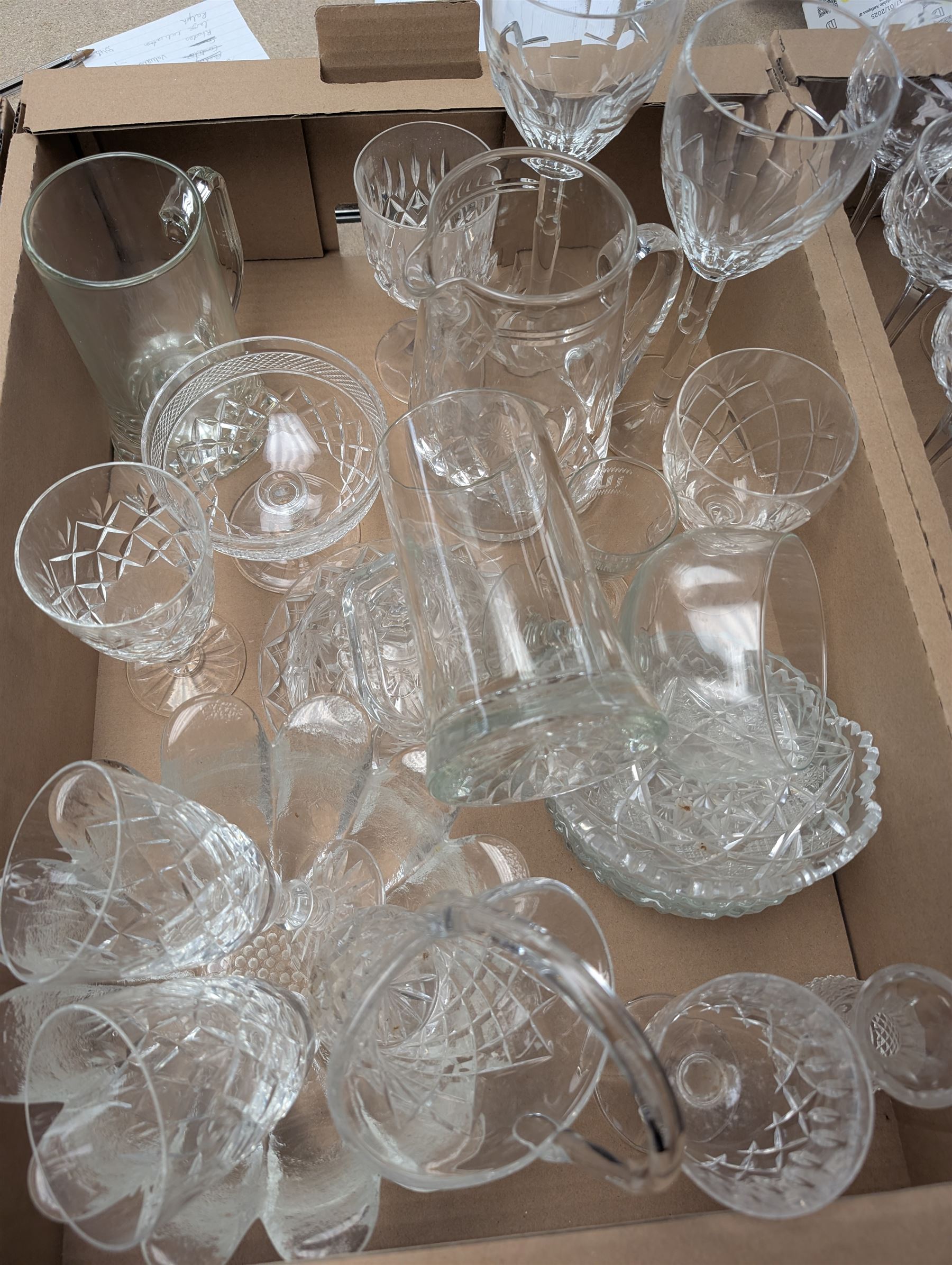 Collection of crystal and glassware, including pair of Stuart Crystal wine glasses, other Stuart Crystal glasses, etched balloon glasses and a collection of other glassware, in two boxes
