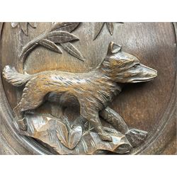 Pair of oak furniture door panels, carved in relief with a fox to one and a hound to the other, together with a pair of smaller oak panels, carved in relief with a hare to one and a grouse to the other, doors W63.cm x H62cm, panels W43cm x H60cm