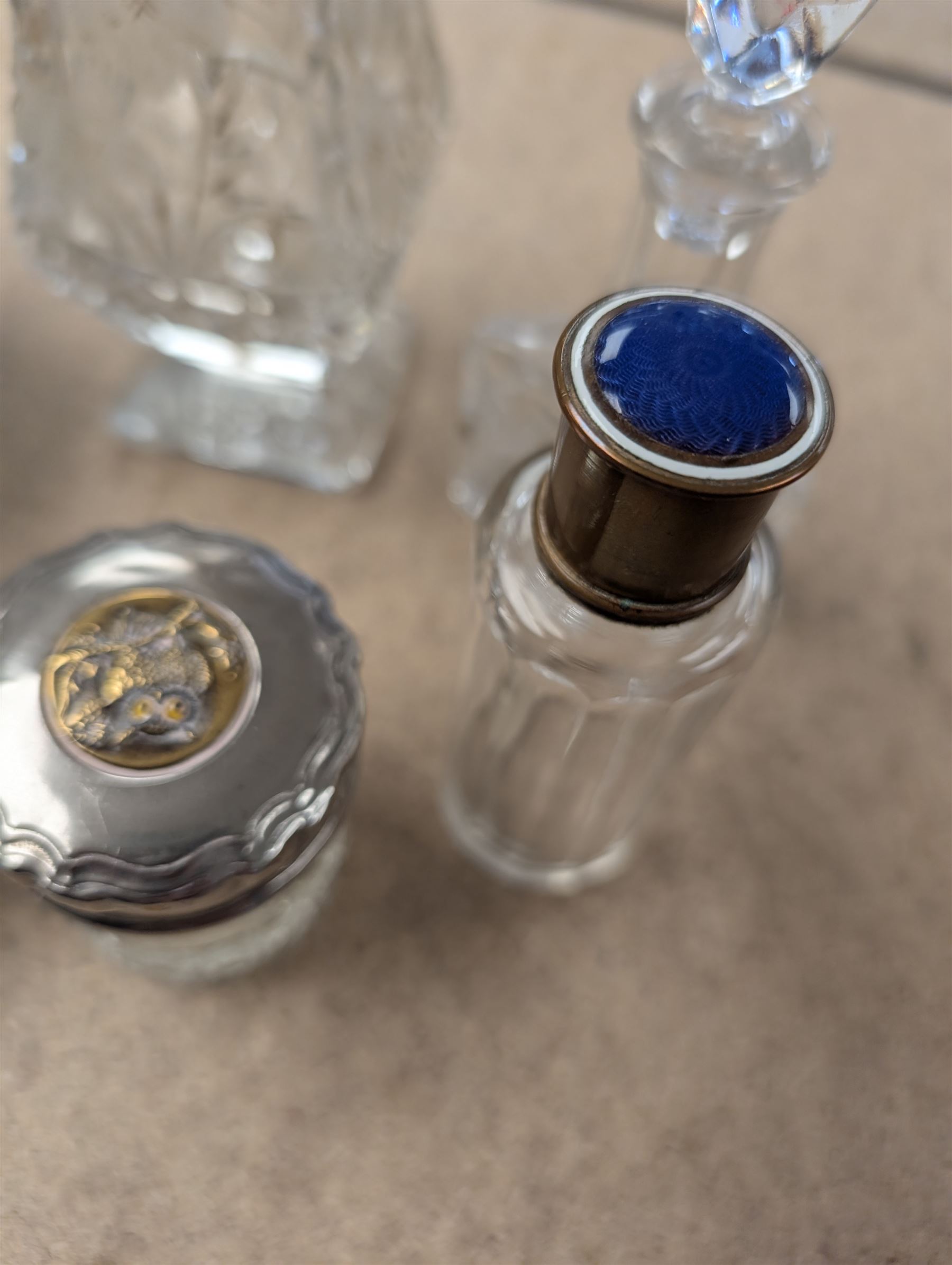 Collection of perfume bottles, including cut glass, silver mounted, coloured glass and miniature examples, tallest H