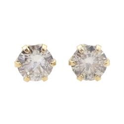Pair of gold round brilliant cut diamond stud earrings, stamped K18, total diamond weight approx 0.20 carat 