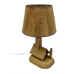 Mid 20th century Paul Caron carved table lamp, modelled as man standing before an oven, the chimney supporting the panelled shade, the base signed P.E. Caron, H42cm