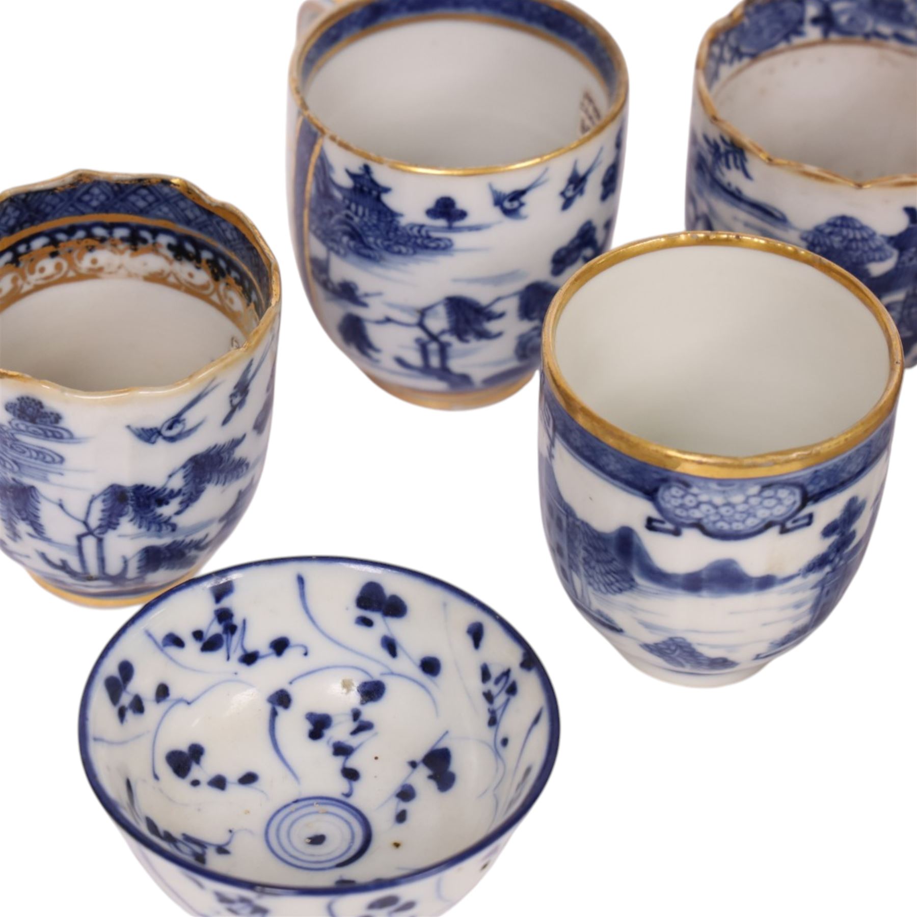 Five 18th century Qing Dynasty export coffee cups, all similar decoration in blue and white with gilt detail, together with two tea bowls  