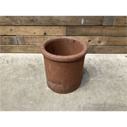 Cast iron cauldron set pot with 2 terracotta chimney pots and 2 terracotta planters,