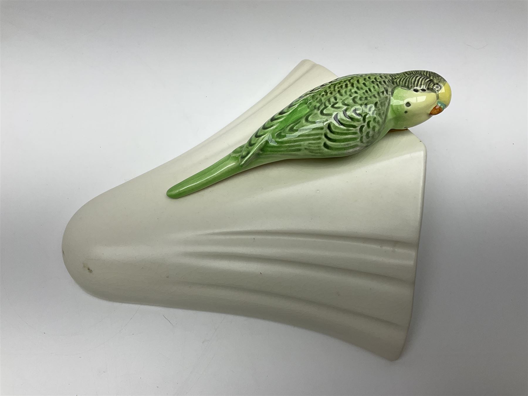 Sylvac budgieregar wall pocket, together with other Sylvac cermics including swan vases, blue tit vase and a frog figure etc, all with printed or impressed marks beneath, and a Poole Pottery cat figure, with printed mark beneath, wall pocket H22cm