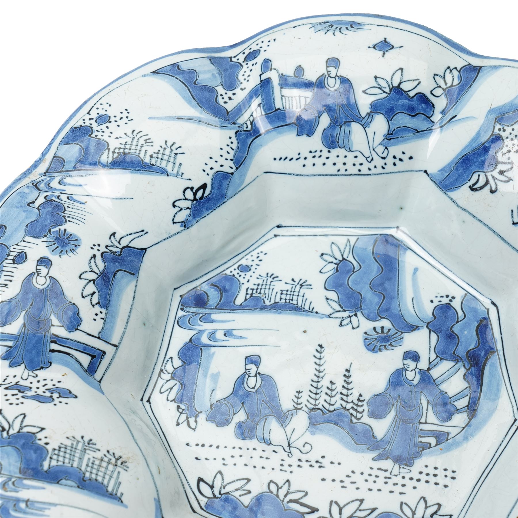 Early 18th century Frankfurt tin glazed earthenware shallow dish decorated in blue with panels of Chinese figures and landscapes D34cm