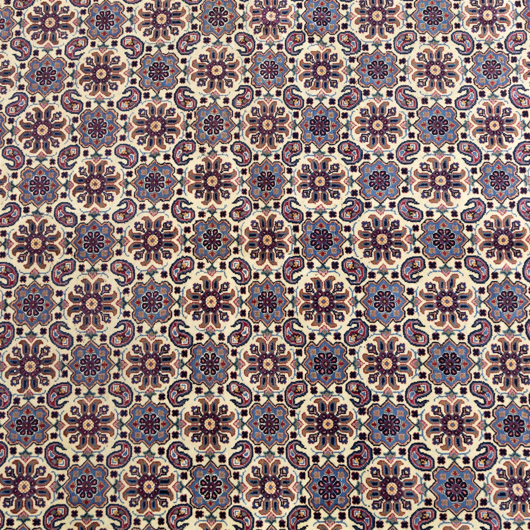 North West Persian Tabriz hand-knotted carpet, ivory field densely decorated with an all-over Herati style (Mahi) lattice composed of stylized rosettes and scrolling leaves, enclosed by a broad madder-red border of palmette and floral vine design, between navy guard stripes, cotton fringe ends 