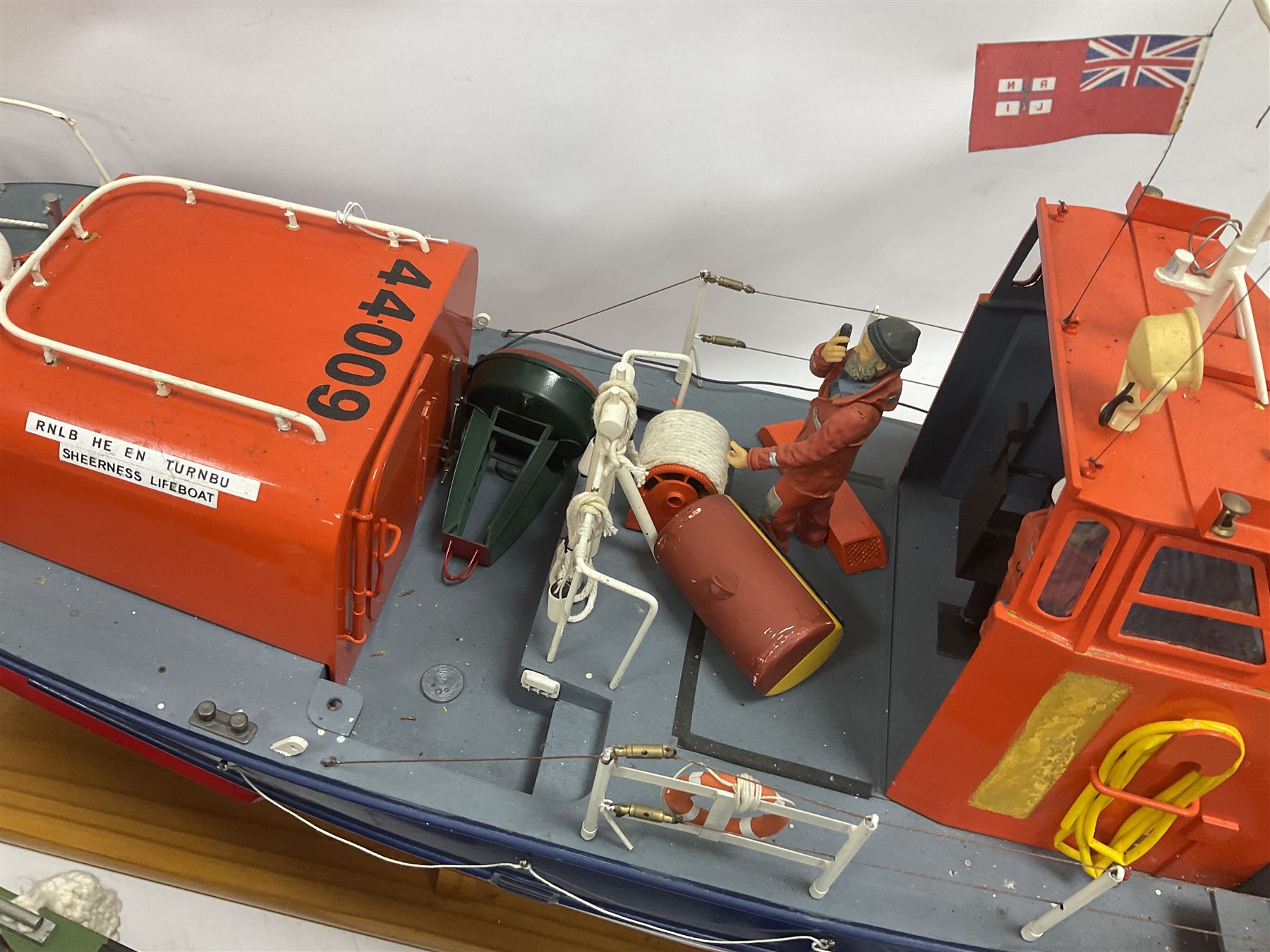 Two remote controlled kit-built plastic model boats - RNLB Sheerness Lifeboat Helen Turnbull L92cm and 'Conserver' Grangemouth L76cm; each on wooden stand; together with three remote control units