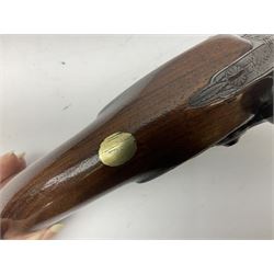 Early 19th century flintlock 16-bore overcoat/duelling pistol by William Bond Lombard Street London, the 23cm octagonal brown stub twist damascus barrel with small foresight, two barrel pins and ram rod under, inscribed Lombard Street London to the top and W. Bond to the action, full walnut stock with lightly engraved steel furniture, pineapple finial and escutcheon, half cock facility L39cm; loose mounted on later mahogany display stand with trade label