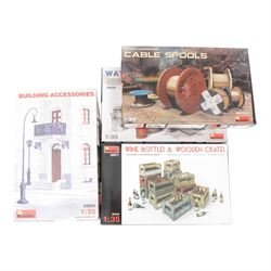 Seventeen Mini Art 1:35 scale model building and accessory kits, comprising 36017 European Farmyard, 35511 Ruined Garage, 35508 Italian City Building, 35536 Ruined Building, 35507 French Farmyard, 36020 Village Road with Ruined House, 36034 Farm Gate with Base, 35537 German Pharmacy Ruin, 35502 House Accessories, 35005 Building Accessories, 35583 Cable Spools, 35571 Wine Bottles and Crates, 35530 Street Accessories, 35578 Water Pump, 35581 Wooden Boxes and Crates and two 35550 Wooden Barrels and Village Utensils, all boxed