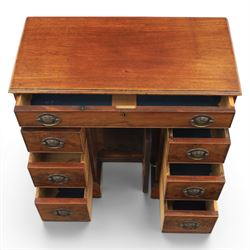 Early 20th century Georgian design figured walnut kneehole desk, rectangular moulded top over one long frieze drawer, kneehole recess with cupboard and drawer above, flanked by six short drawers with oval pressed brass handle plates, moulded plinth base on bracket feet