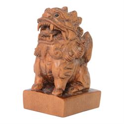  Two wooden netsuke, in the forms of a foo dog and a chicken, both signed to the base, H6cm