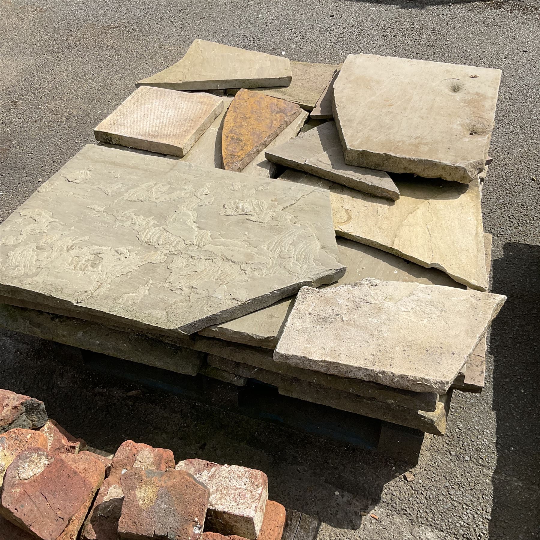 Various paving slabs, coping stone and odd bricks, on five pallets