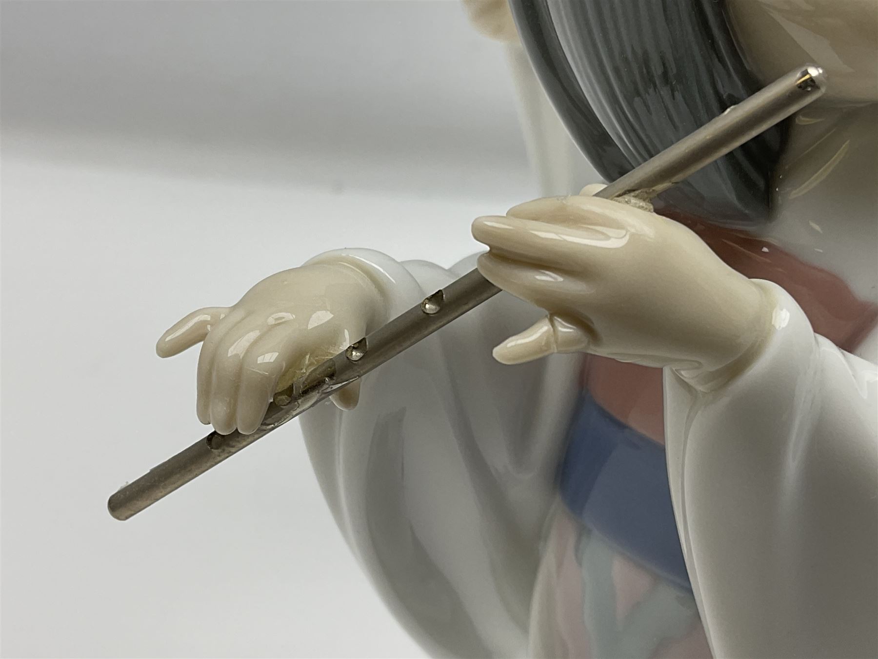 Six Lladro figures of the China doll set and Oriental doll set, comprising Playing the Flute no.6150, Bearing Flowers no.6151, Flower Gazer no. 6152, Oriental Dance no. 6230, Oriental Lantern no. 6231 and Oriental Beauty no. 6232, largest H20cm