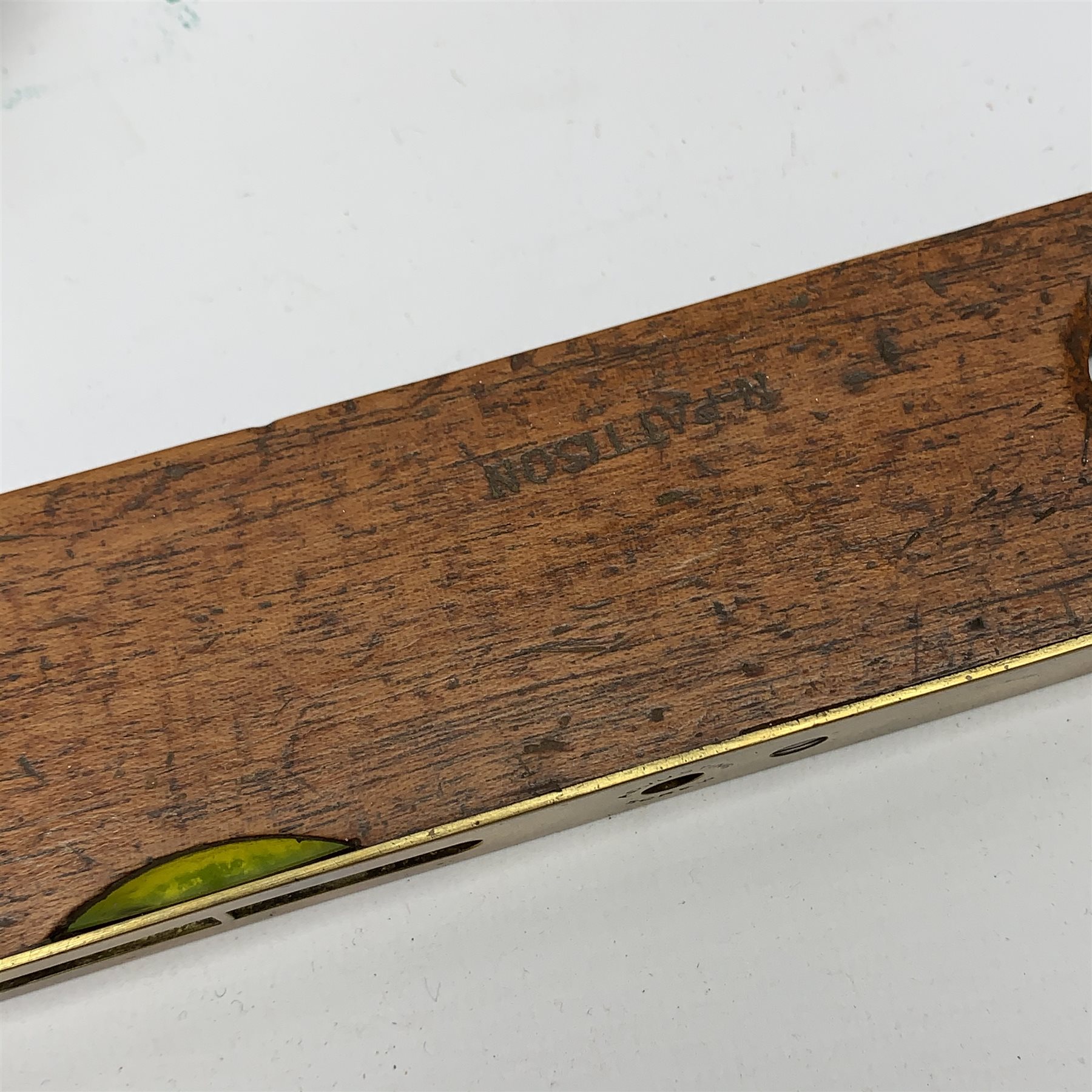 Brass Natural Sine type compass with spirit levels to the dial, bears name of Stanley, D8cm, in earlier mahogany box; brass pocket sextant of drum shaped form, the screw top marked Stanley London; small brass cased compass with pedestal tripod base; and Glass Developments Ltd. hahogany and brass spirit level L31cm (4)