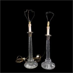 Near pair of large 19th century cut glass table lamps, each of columnar form with diamond cut tapering stem and silver plated Corinthian capital, raised upon a circular faceted foot (one slightly smaller), H71cm overall 