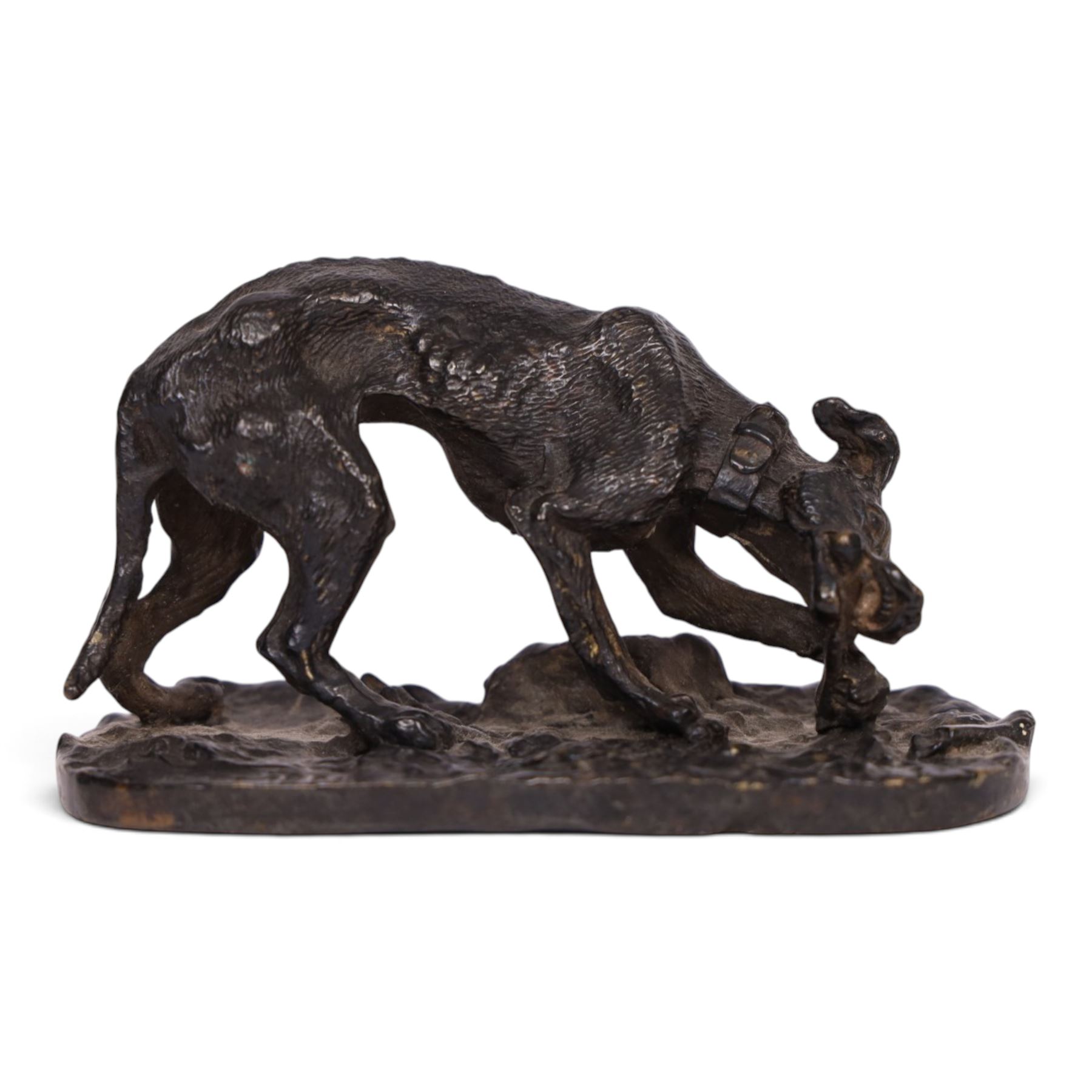 After R J Mene, bronze modelled as a dog with a bone, H5cm, L10cm 