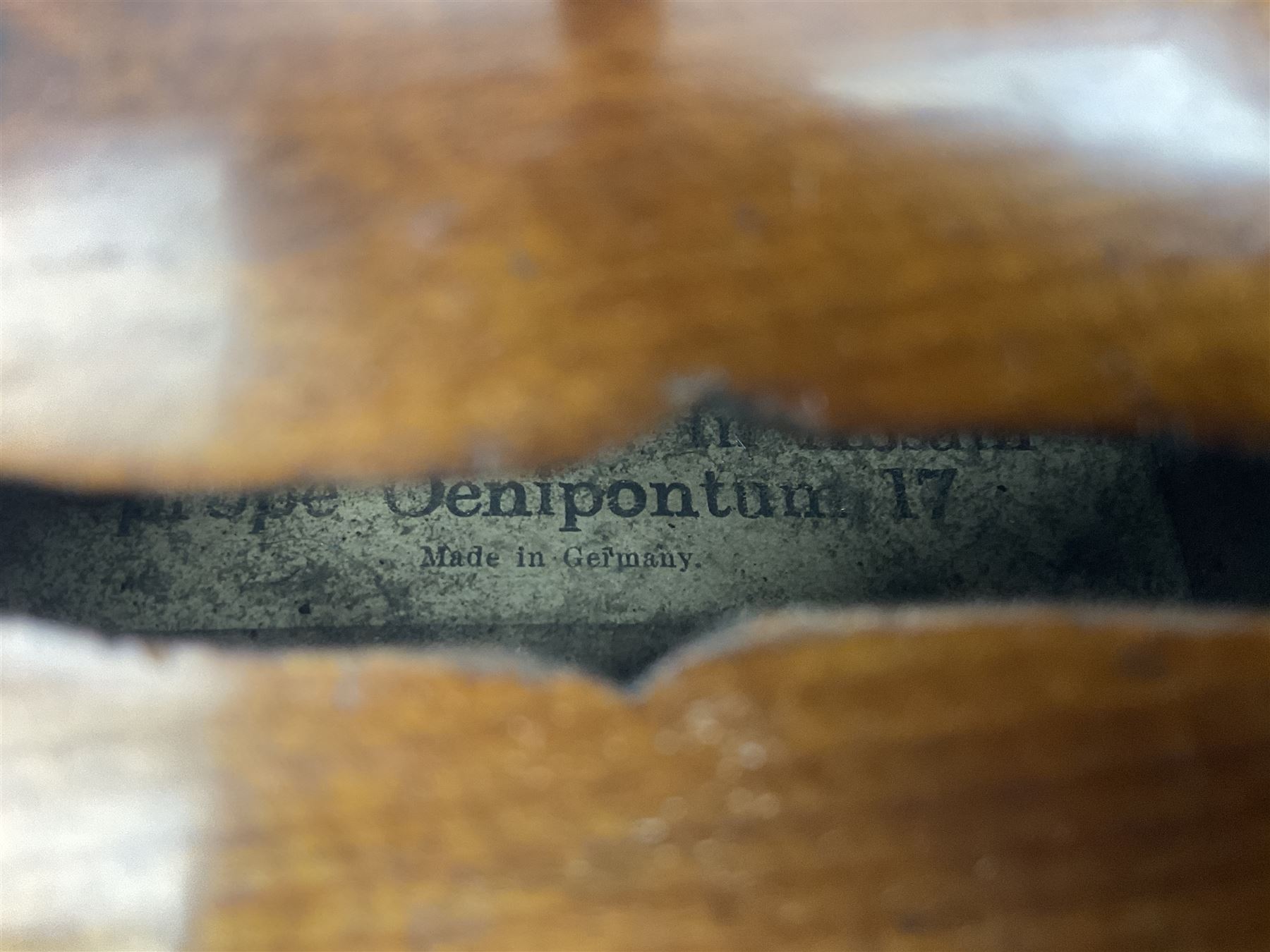 German Saxony violin c1900 with 35.5cm two-piece medium grain maple back and ribs and medium grain spruce top; bears label 'Jacobus Stainer in Absam prope Oenipontum 17xx Made in Germany', 59.5cm overall; with modern bow (2)