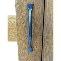 Laura Ashley - contemporary Milton oak display cabinet, featuring single door with two glass panels and pewter effect handle, enclosing one fixed oak shelf and two adjustable glass shelves, access hole at the bottom shelf, over single drawer with matching handle, on square legs