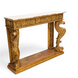 Pair of carved giltwood and composition console or pier tables, rectangular variegated rouge marble top, the frieze decorated with trailing vine and grape bunches, eagle front supports on stepped rectangular base