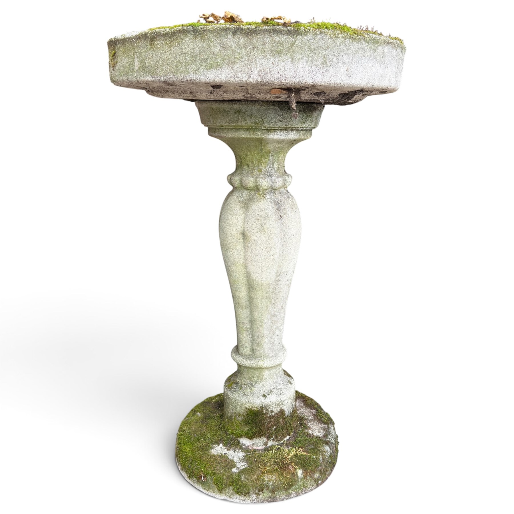 Weathered cast stone birdbath, circular bowl over a lobed baluster pedestal on circular base; weathered cast stone sundial of squared form with re-entrant corners and removable metal sundial with personified death motif