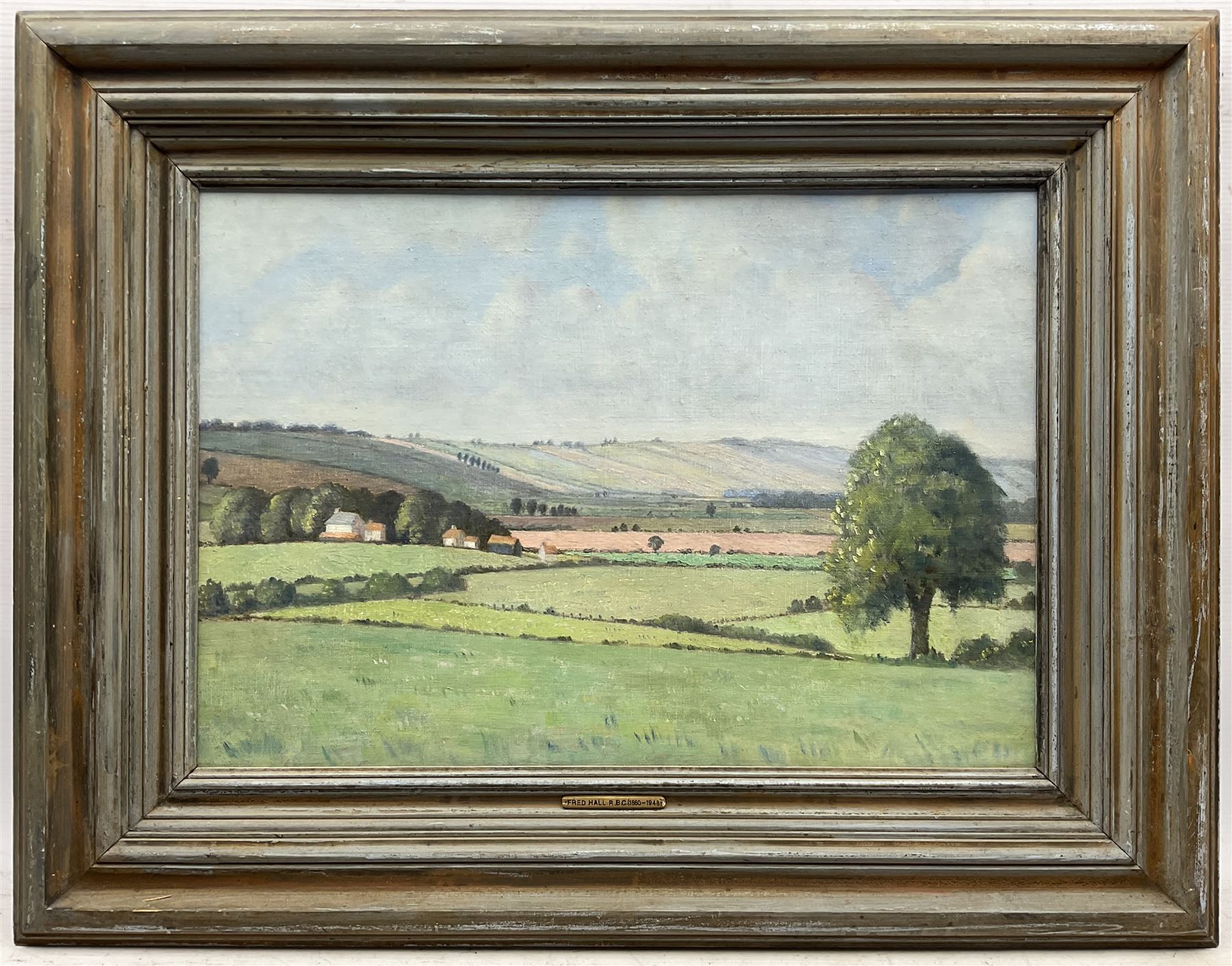 Frederick 'Fred' Hall (British 1860-1948): 'West Storrington - Sussex', oil on canvas laid on to board, signed and titled verso 38cm x 55cm