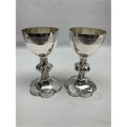 Group of Victorian Ecclesiastical silver-plate by Henry Wilkinson & Co, Sheffield, comprising two chalices with pierced stems and knops raised upon shaped petal feet, ewer engraved Presented By Brorklebank to the South Cliff ... Church Scarborough 1886, comport with petal shaped foot and two plates, all engraved with the IHS Christogram and various religious Latin phrases, tallest H26cm